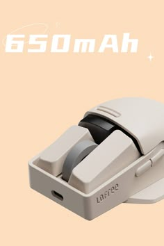 an old computer mouse with the word gomah on it's back side