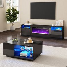 a living room filled with furniture and a flat screen tv on top of a wall