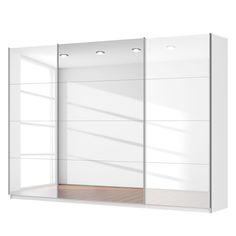 an empty white closet with two doors