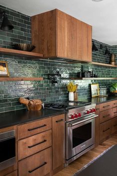 a kitchen with wooden cabinets and stainless steel appliances