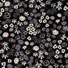 a black and white floral pattern with many different flowers on the side, all in various colors