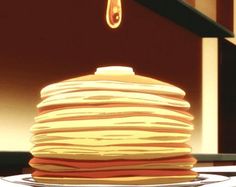 a stack of pancakes sitting on top of a counter