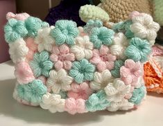 a crocheted purse sitting on top of a table