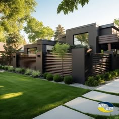 a modern house with landscaping and trees in the front yard