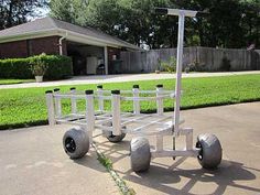 a white cart sitting on top of a sidewalk