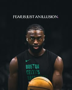 a man holding a basketball in his hands with the caption fear just an illusion