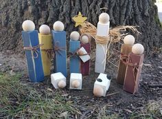 several wooden pegs are tied together in front of a tree