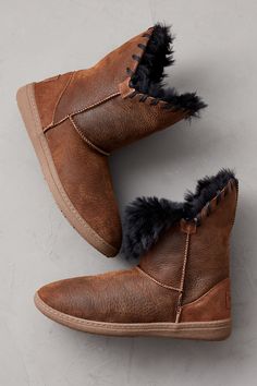 Give your winter look a playful, pretty pop with the Wren sheepskin boot, crafted to keep you comfy and warm wherever the day takes you. Made from insulating double-faced shearling sheepskin, these easy-on boots can be styled two ways: worn up to showcase a distinctive whipstitch detail along raw-edge cuffs, or folded down to reveal their plush interior—the magically soft component that keeps your feet cozy from cuff to toe. Thermo rubber insoles and Goodyear welt construction provide sturdy sup Cozy Leather Boots For Fall, Sheepskin Boots With Round Toe For Cold Weather, Sheepskin Boots For Cold Weather With Round Toe, Brown Sheepskin Boots With Faux Fur Lining, Waterproof Suede Boots, Suede Cowboy Boots, Ankle Cowboy Boots, Stylish Footwear, Sheepskin Slippers