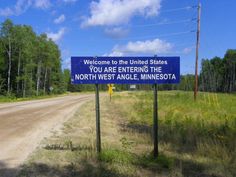 a blue sign that says welcome to the united states you are entering the north west angle minnesota