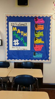 a bulletin board is hanging on the wall in a classroom with desks and chairs