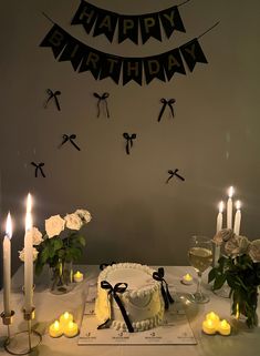 a birthday cake on a table with candles