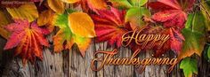 happy thanksgiving greeting card with autumn leaves on wooden planks and the words happy thanksgiving