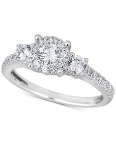 three stone diamond engagement ring in 18k white gold with 0 25ct round diamonds