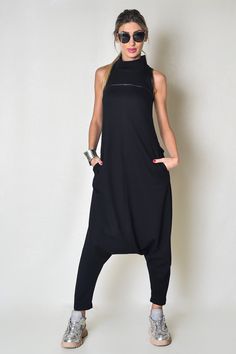 Extravagant black women's jumpsuit made of soft fabric fitted at the top and a zipper at the back. Fits astonishingly well in all sizes.  SHIPPING within 2-3 DAYS MATERIAL: 50% High-Quality Cotton, 50% Polyester AVAILABLE SIZES: - XS, S, M, L, XL, and extra-large: 2X, 3X, 4X - View the size chart photo above DETAILS: This jumpsuit is perfect for all occasions - weddings, gatherings, and hanging out This piece has been carefully designed in my small studio in the heart of Sofia-Capital. Take a look at the other items in my shop and please let me know what you think https://www.etsy.com/shop/wearekvs Thanks for stopping with wearekvs! Black High Neck Jumpsuits And Rompers, Abaya Pattern, Women Romper, Rocker Outfit, Stylish Jumpsuit, Womens Jumpsuits, Cotton Jumpsuit, Small Studio, Street Style Chic