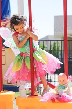 Your little one will bring the the beauty of springtime to life and dazzle everyone in their new Springtime Fairy dress up. Soft green stretch velvet bodice with pink ribbon accents Hot pink tea length china silk skirt with overlain fabric and organza petals Beautiful spring flowers accenting the waistline Breathable, Silky Soft, 100% Polyester Fabrics Accessories Sold Separately Spring Fairytale Fairy Dress For Dress-up, Spring Fairytale Fairy Dress, Spring Fairytale Dress For Dress-up, Princess Style Fairy Dress For Costume Party In Spring, Spring Fairy Tulle Dress, Fairy Style Tulle Dress For Garden Party, Green Princess Dress For Spring Fancy Dress, Pink Tulle Tutu Dress For Garden Party, Spring Fairytale Fairy Dress For Costume Party