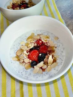 two bowls filled with oatmeal and fruit