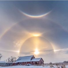 two circles are seen in the sky above a barn