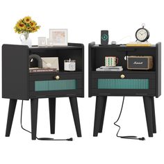 two black nightstands with drawers and one has a clock on the top, another has a flower vase