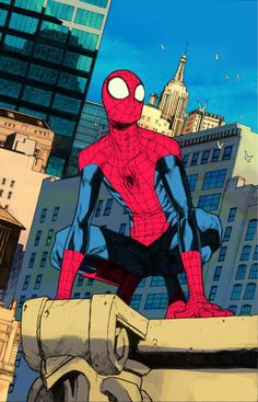 a spider - man sitting on top of a building in the middle of a city