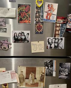 the refrigerator is covered with magnets and pictures