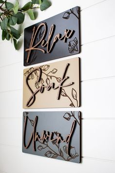 three metal wall hangings with the words relax, sleep and mind