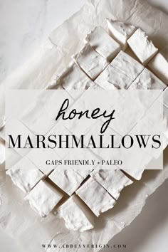 the words honey marshmallows are on top of some white paper with black lettering