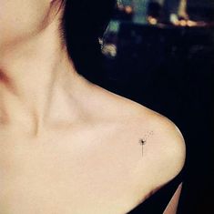 a woman with a small tattoo on her chest