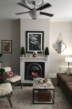 a living room filled with furniture and a fire place