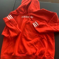 Adidas Hoodie- New Never Worn. Adidas Hoodie With Three Stripes, Adidas Hoodie Sweatshirt With Three Stripes, Adidas Three Stripes Hoodie Sweatshirt, Adidas Hoodie With Ribbed Cuffs For Sports Season, Red Drawstring Hood Sweatshirt For Winter, Red Winter Sweatshirt With Drawstring Hood, Adidas Hoodie With Three Stripes For Sports Season, Adidas Casual Hoodie For Sports Season, Adidas Cotton Hoodie With Three Stripes