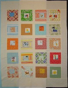 a wall hanging made up of many different colored squares and designs on it's sides