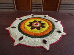 a colorful rug on the ground in front of two doors