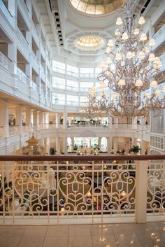 a chandelier hanging from the ceiling in a large building