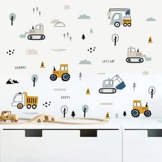 the wallpaper is decorated with construction vehicles and trees