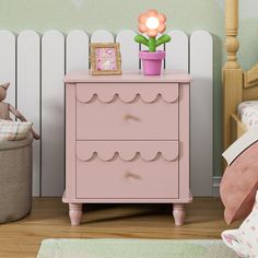 a pink dresser sitting next to a bed in a bedroom