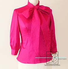 Bow Blouses are in and for a stunning mix in fashion and romance, the bow blouse, is a perfect example of a blouse that can maintain a business look while still sporting an air of pleasantry. The bow neckline adds a soft, feminine touch and you will defiantly impress others with these custom 3/4 quarter sleeve bow blouses. The blouse has a tailor fit and is very comfortable to wear. Made with 100% Slight Stretch Taffeta. The blouse features: * 3/4 Tailored sleeves with gathers at the shoulder *G Soft Feminine, Bow Blouse, Blouse For Women, Large Bow, Women Plus Size, Business Look, Pink Blouse, Plus Size Blouses, Blouse Styles