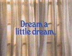 the words dream are written on curtains