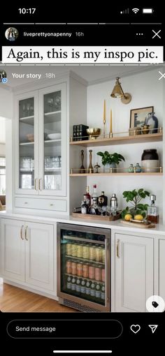 a kitchen with lots of white cabinets and open shelves on the wall, along with an appliance