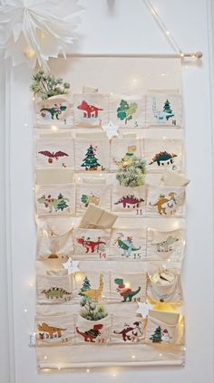 a wall hanging with christmas decorations on it