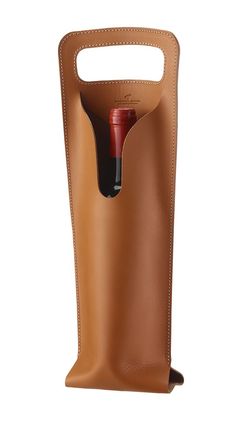 a brown leather bottle holder with a red wine in it