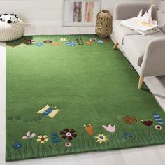 a living room with a green rug on the floor