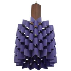 a sculpture made out of purple plastic tubes and wood dows on a white background