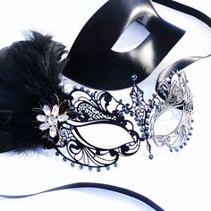 Couples masquerade masks, black feather, women metal mask and Venetian men mask Women black mask studded with black onyx rhinestones that give a hint of metallic shade. This mask has black with feathers with black/gold crystal brooch. Men's mask is a simple black base with a comfortable fit. S H I P P I N G - Processed same day or within 24 hours. 1-2 day guaranteed delivery services offered, add items to cart and click on shipping tab for rates. Please leave a check out note with your need date Black Masquerade Mask For Halloween Gift, Black Masks For Halloween Gift, Black Halloween Masks As Gifts, Black Masks For Carnival, Black Masks And Prosthetics For Carnival Gift, Venetian Black Masquerade Mask, Black Masks And Prosthetics For Carnival, Adjustable Black Masks And Prosthetics For Carnival, Black Fantasy Eye Mask