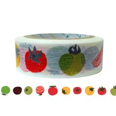 a roll of washi tape with fruit and vegetables printed on the side, all in different colors