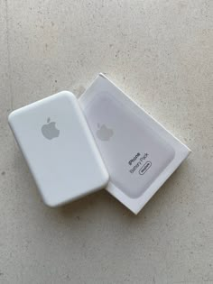 an apple product in its box on the ground