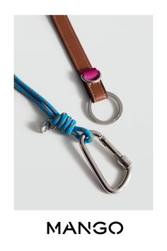 the lanyard strap is made from leather and has a metal hook