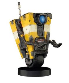 a yellow and black robot statue on a white background with an eyeball in the center