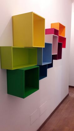 colorful shelves on the wall in an office