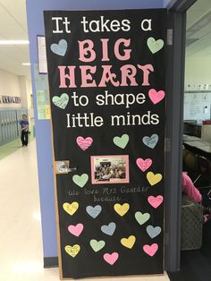 a chalk board with hearts on it that says it takes a big heart to shop little minds