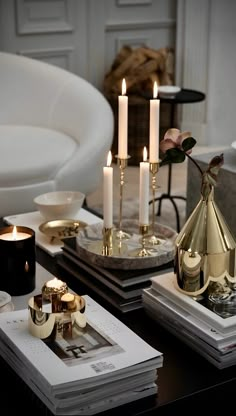 a table topped with candles and other items