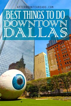 an eyeball with the words best things to do down town dallas in front of tall buildings